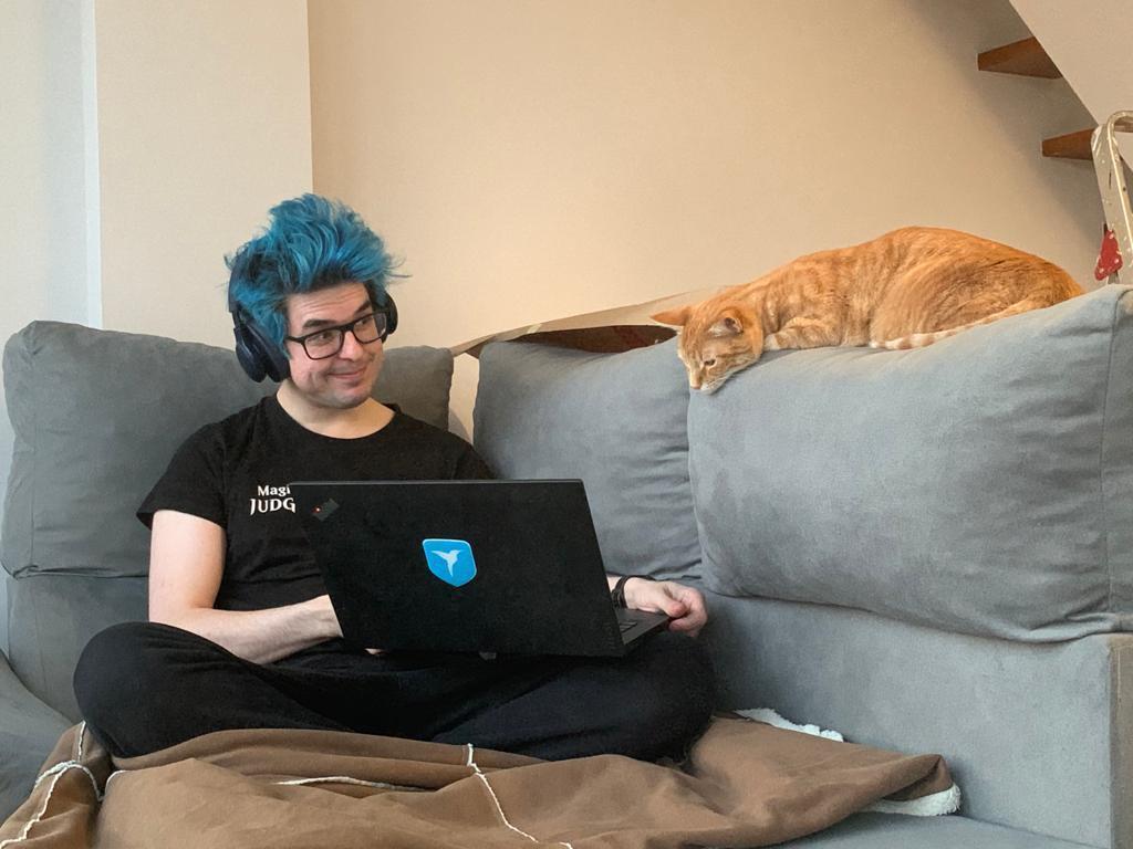 Alex showing code to an orange cat